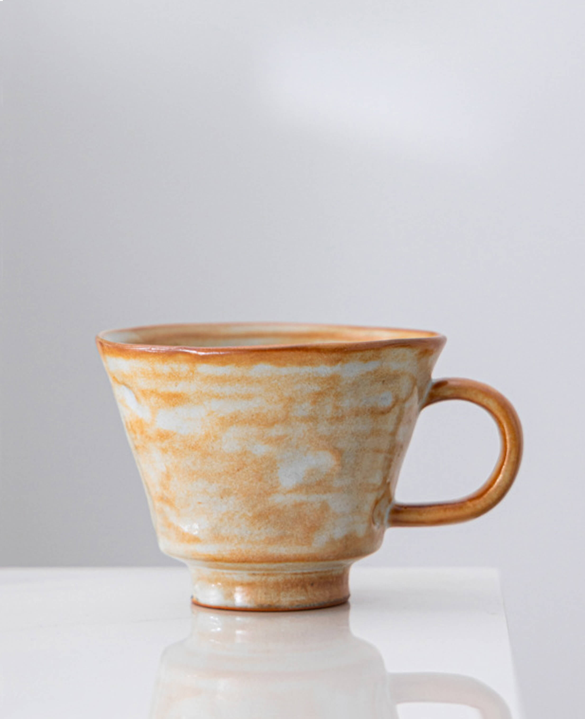 ashenstill handcrafted ceramic coffee and tea cup in earthy glaze artisan australian pottery front view