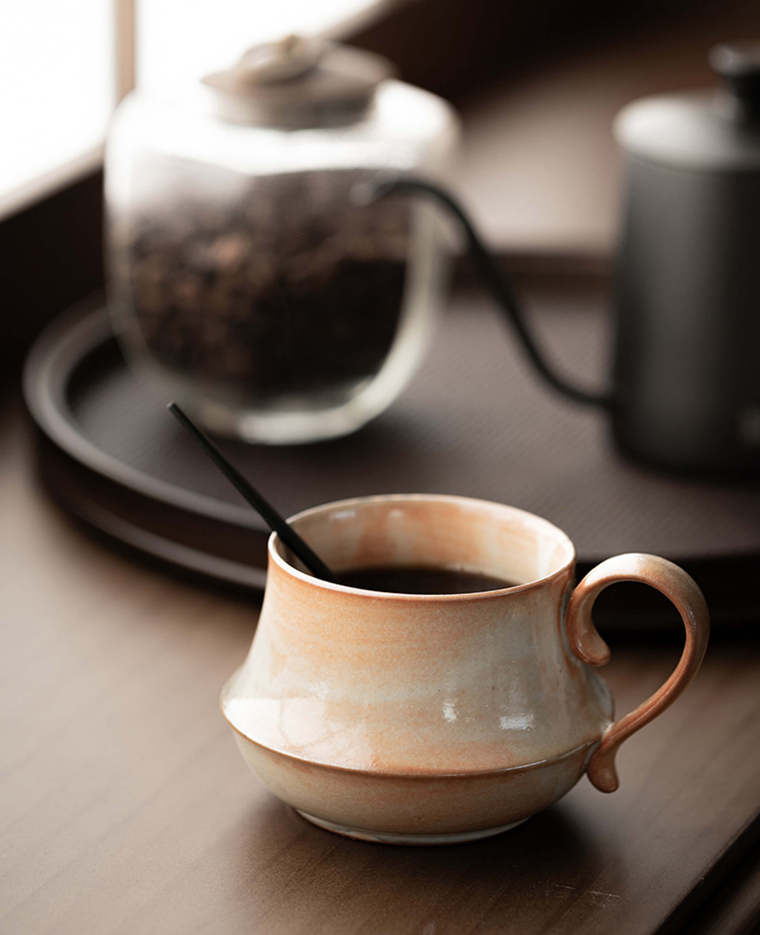 claybourne ceramic coffee and tea mug on wooden tray handmade stoneware filled with steaming coffee