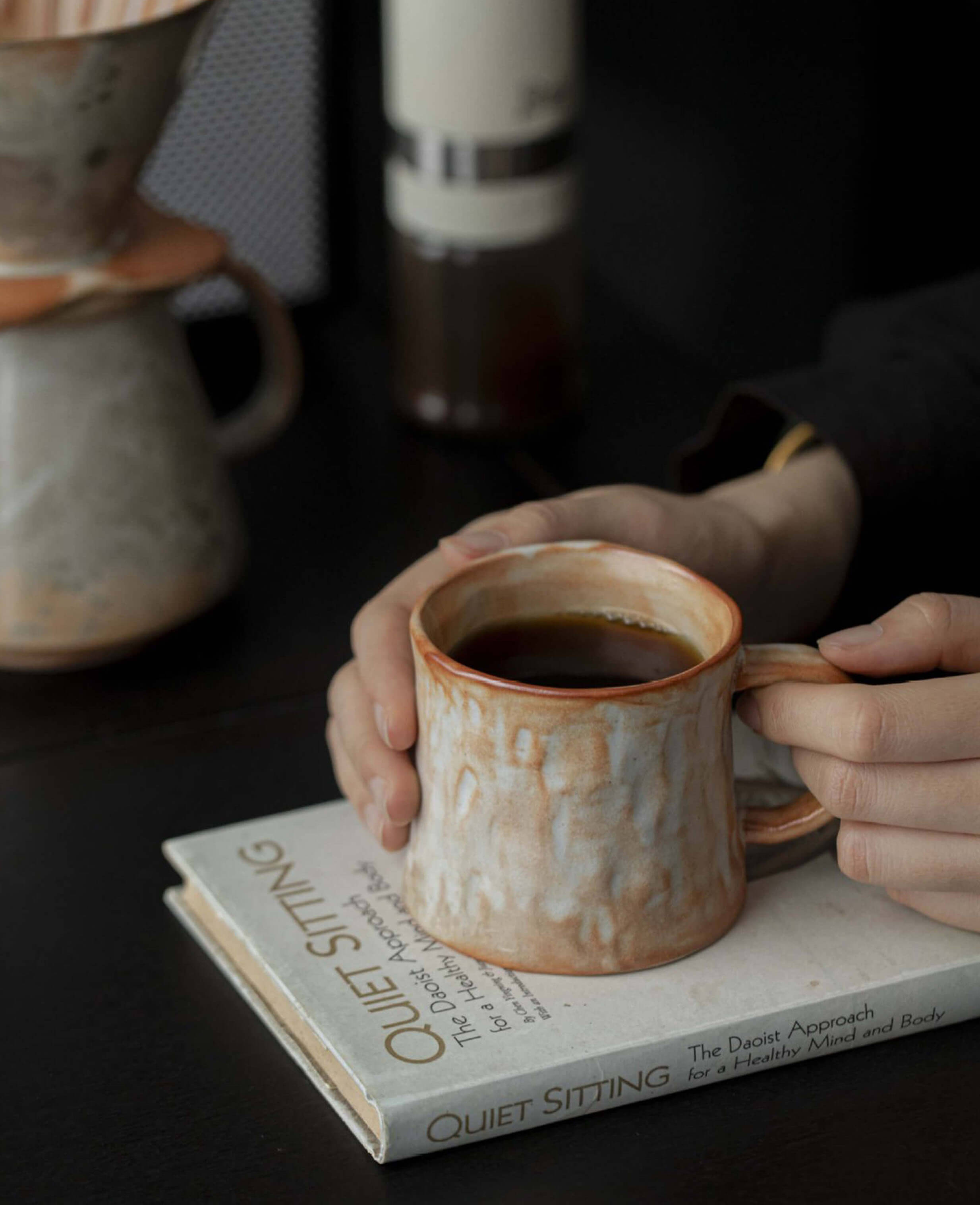 mistburn artisanal handcrafted mug from clayshade collection filled with black coffee held in hands