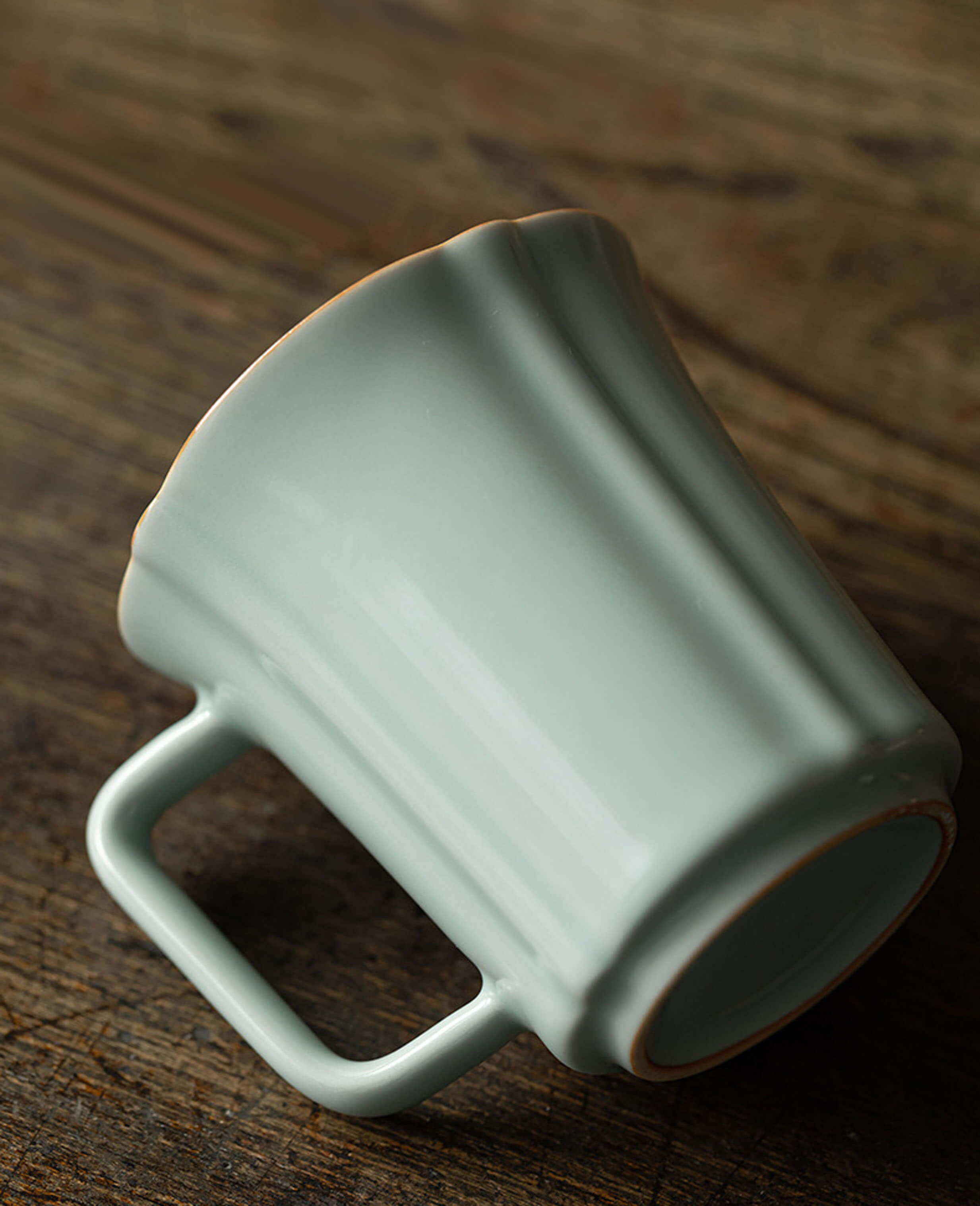 closeup of echo of ru mug showing handcrafted fluted porcelain and angular handle