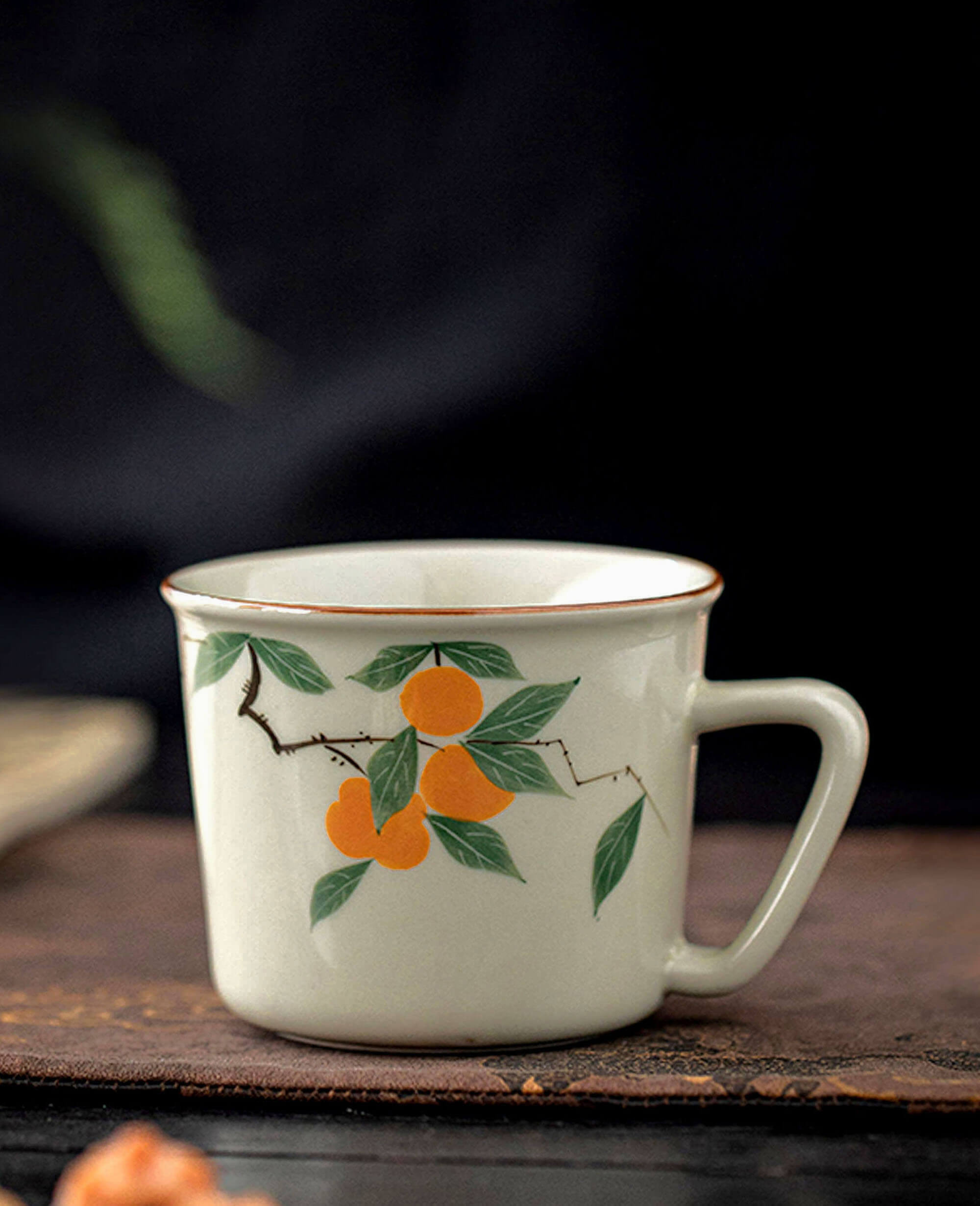 mellow blessing persimmon themed porcelain cup with dark background from painted diary collection