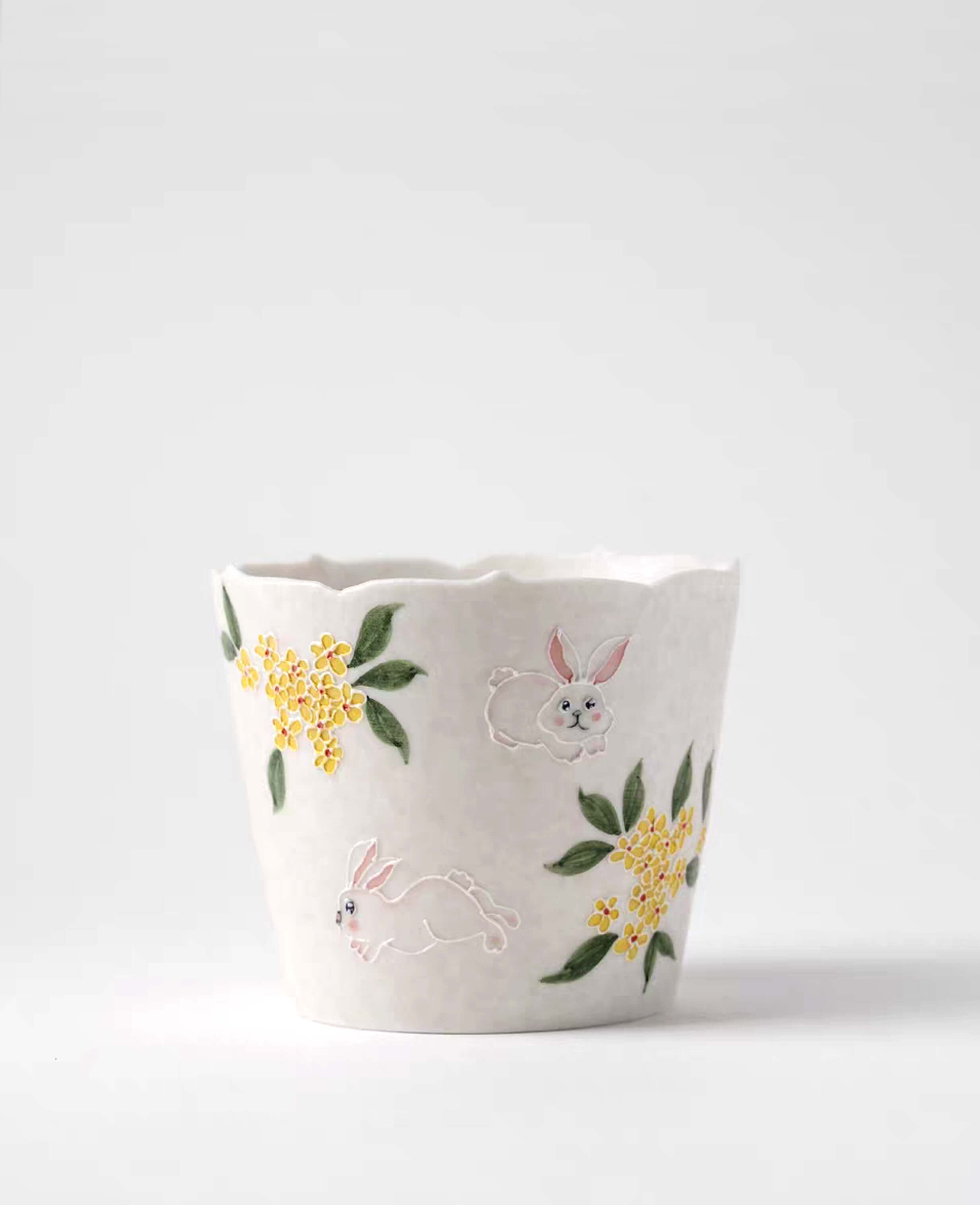 front view of nectar hop hand painted ceramic coffee and tea cup with rabbit and osmanthus flower design