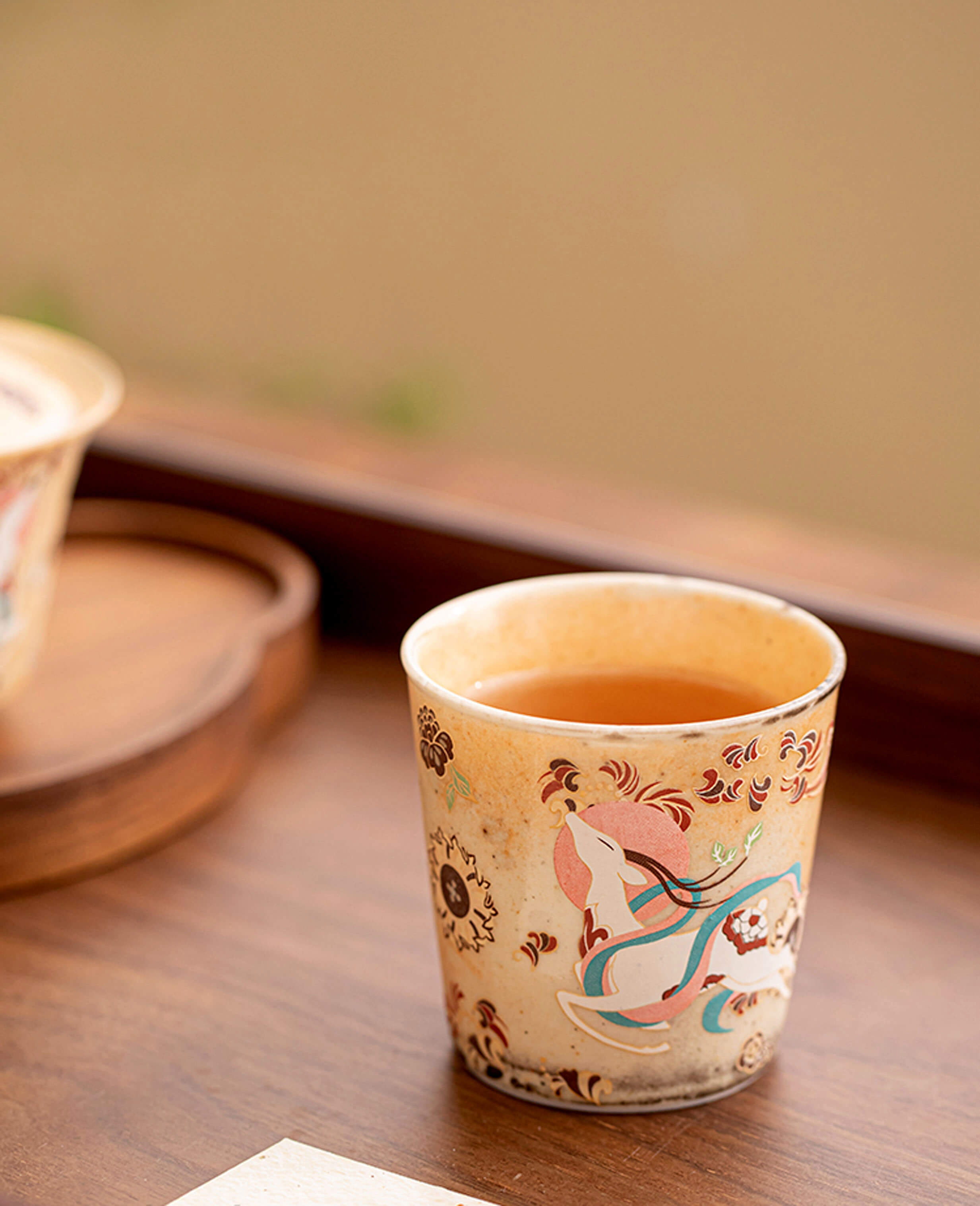 nine coloured deer aroma cup on wooden tray small handcrafted ceramic coffee and tea cup resting on a tray inspired by traditional dunhuang design