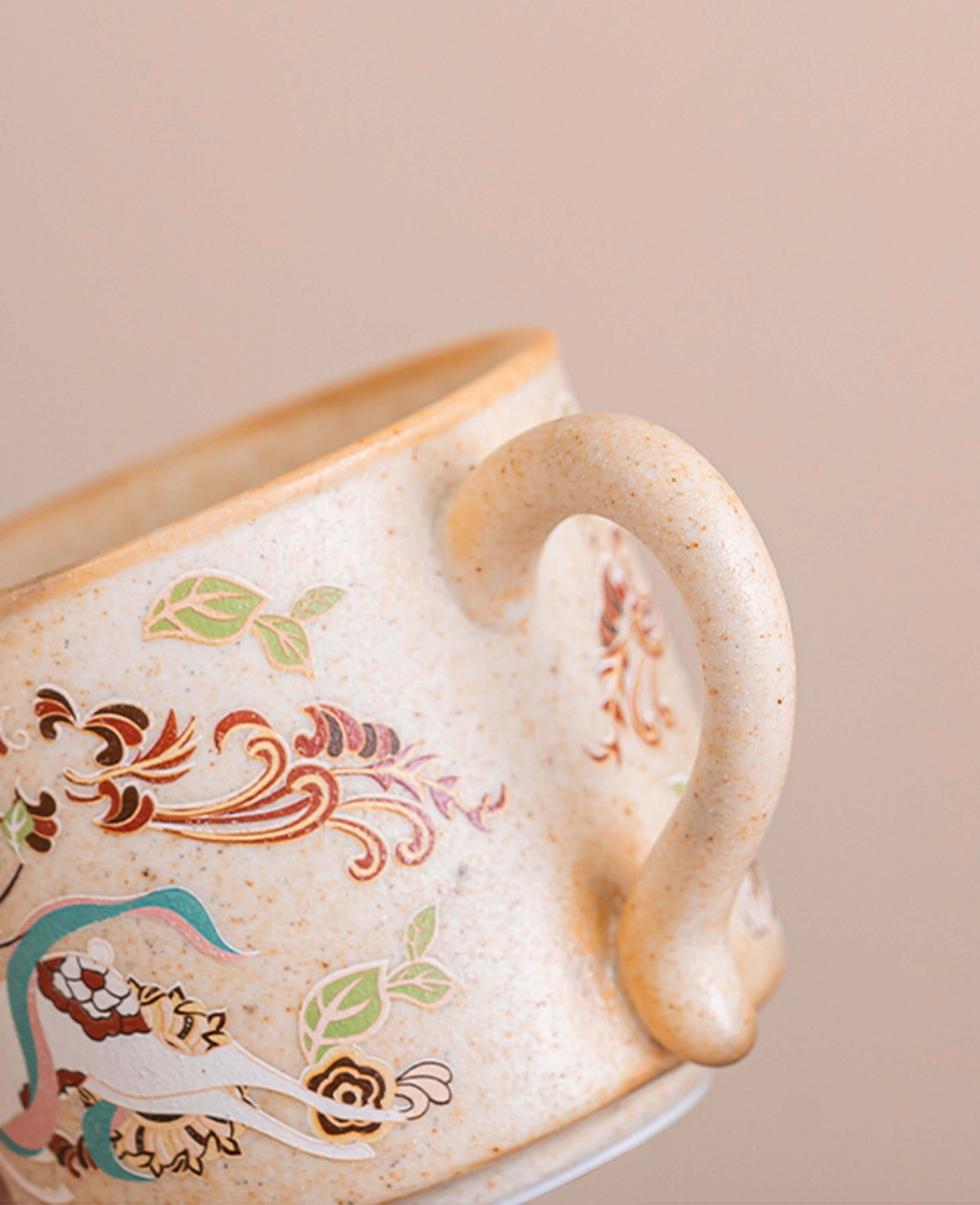 closeup of handle and surface texture on the nine coloured deer ceramic coffee cup
