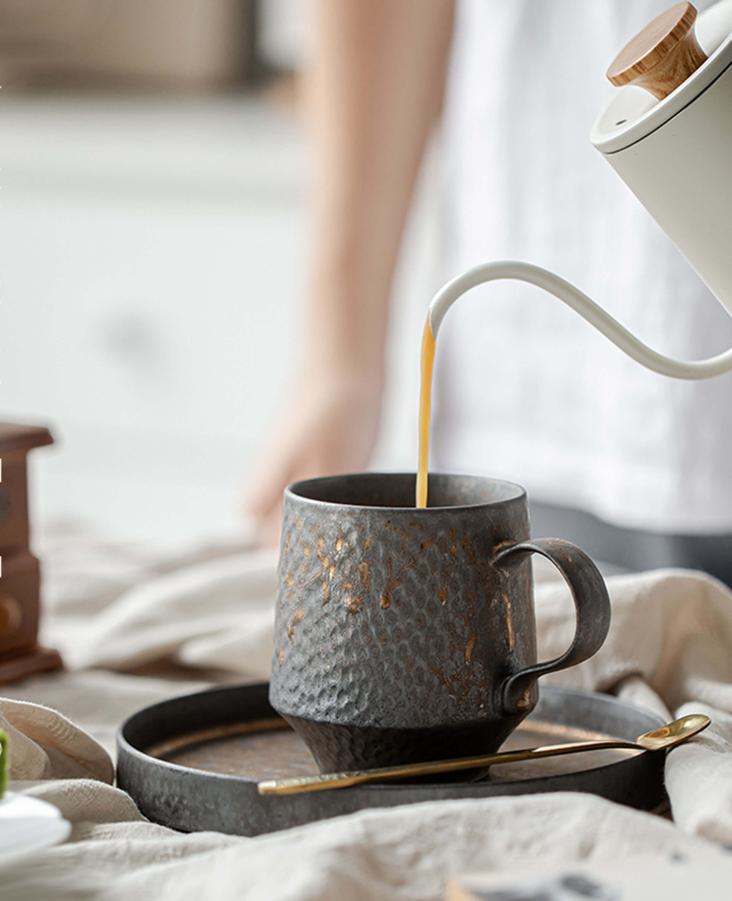 coffee being poured into the rustglow obel cup in a bright minimalist breakfast setting