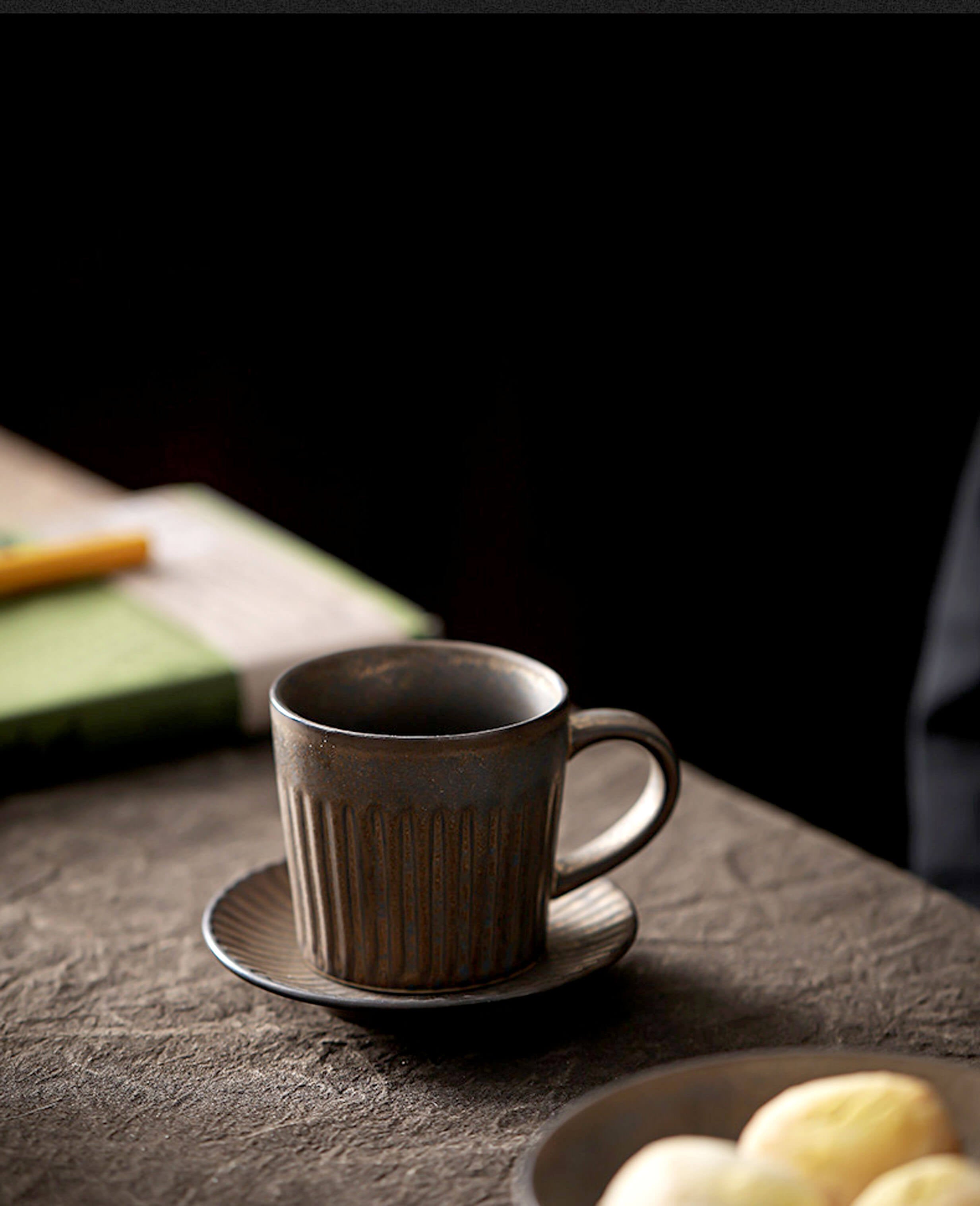 handcrafted rustglow strata stoneware coffee mug and saucer with earthy glaze and minimalist form