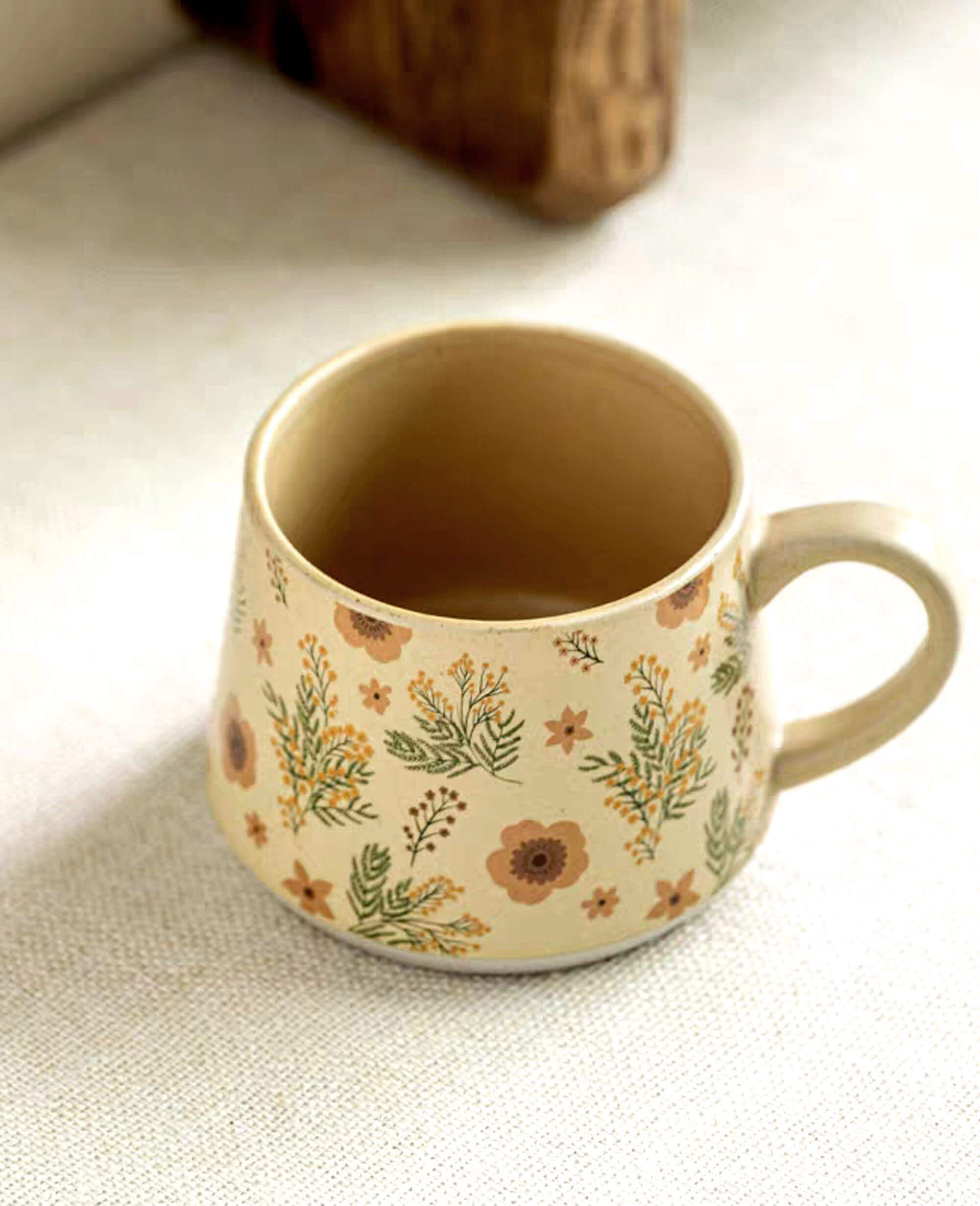 top angle of ceramic coffee and tea mug with wildflower print summer unfenced design natural finish
