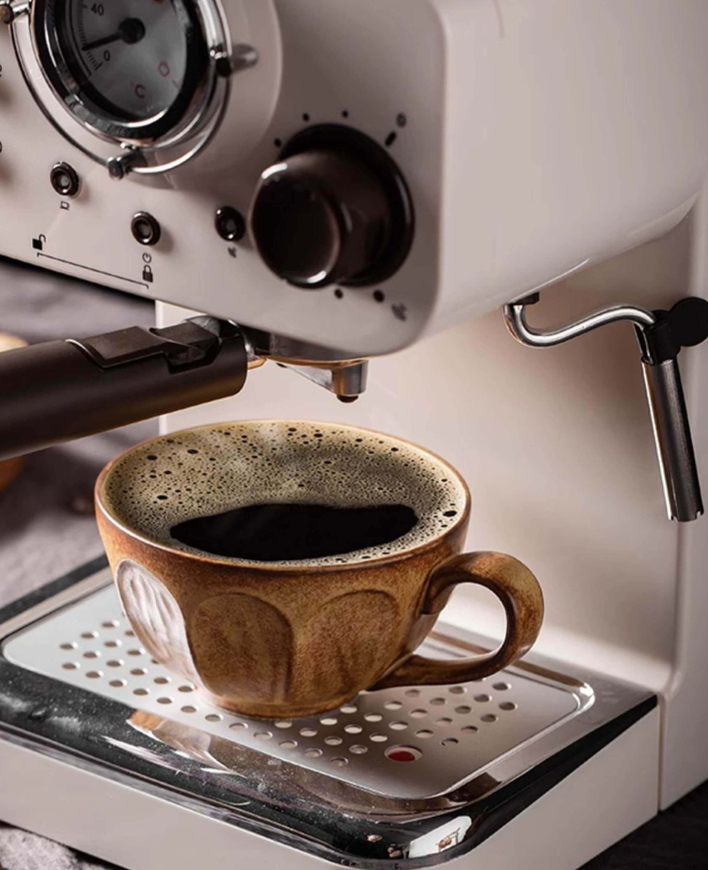 toffee reverie bellara textured stoneware coffee and tea cup in espresso machine