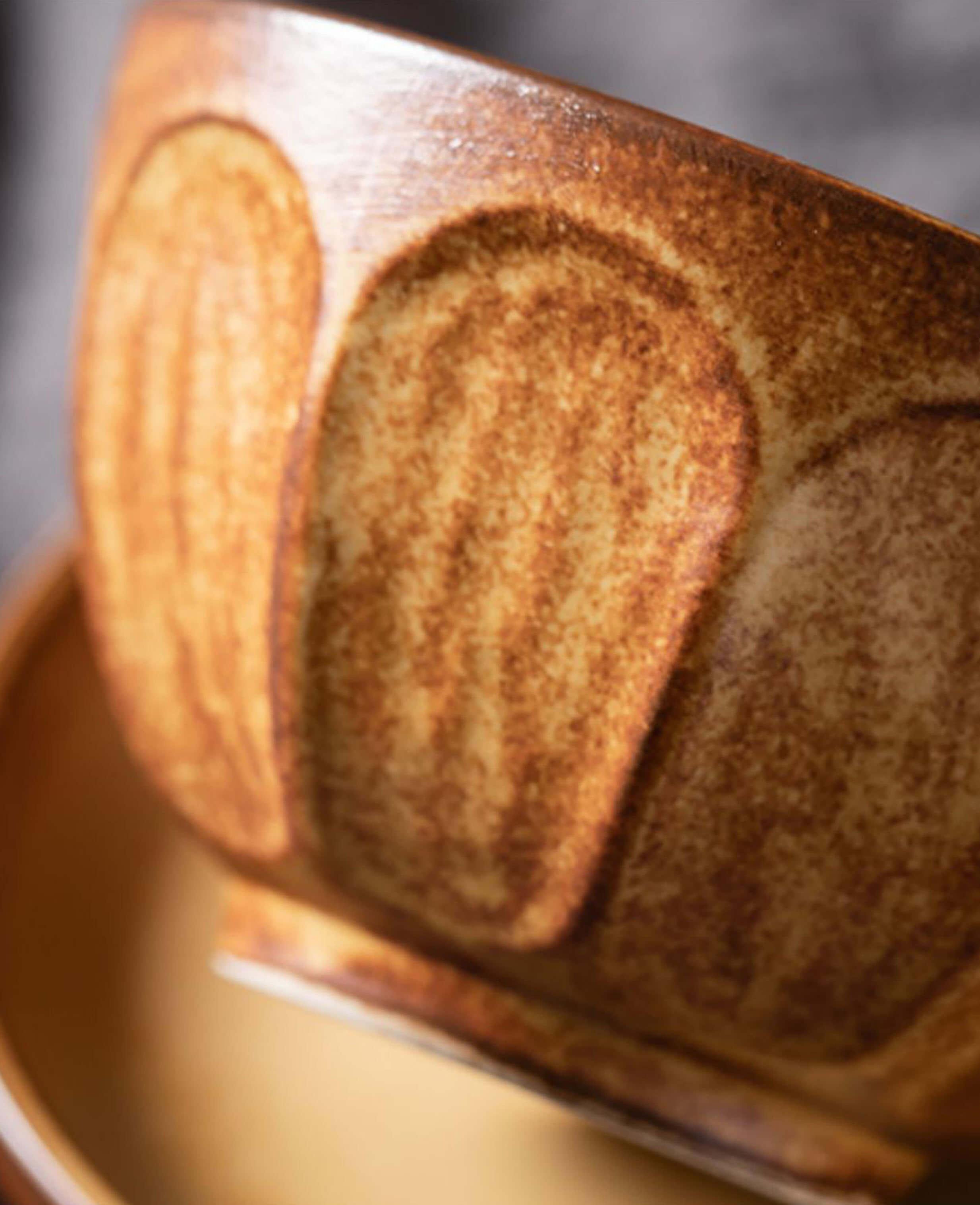 toffee reverie bellara handcrafted ceramic coffee cup closeup highlighting textured glaze