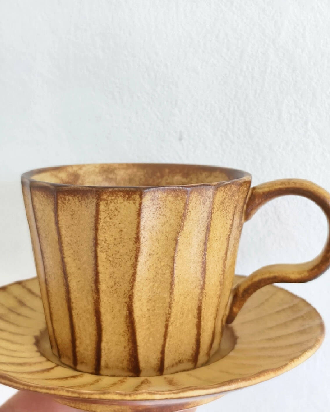 toffee reverie flow stoneware coffee and tea mug shown on a bright minimalist background from customer testimonial