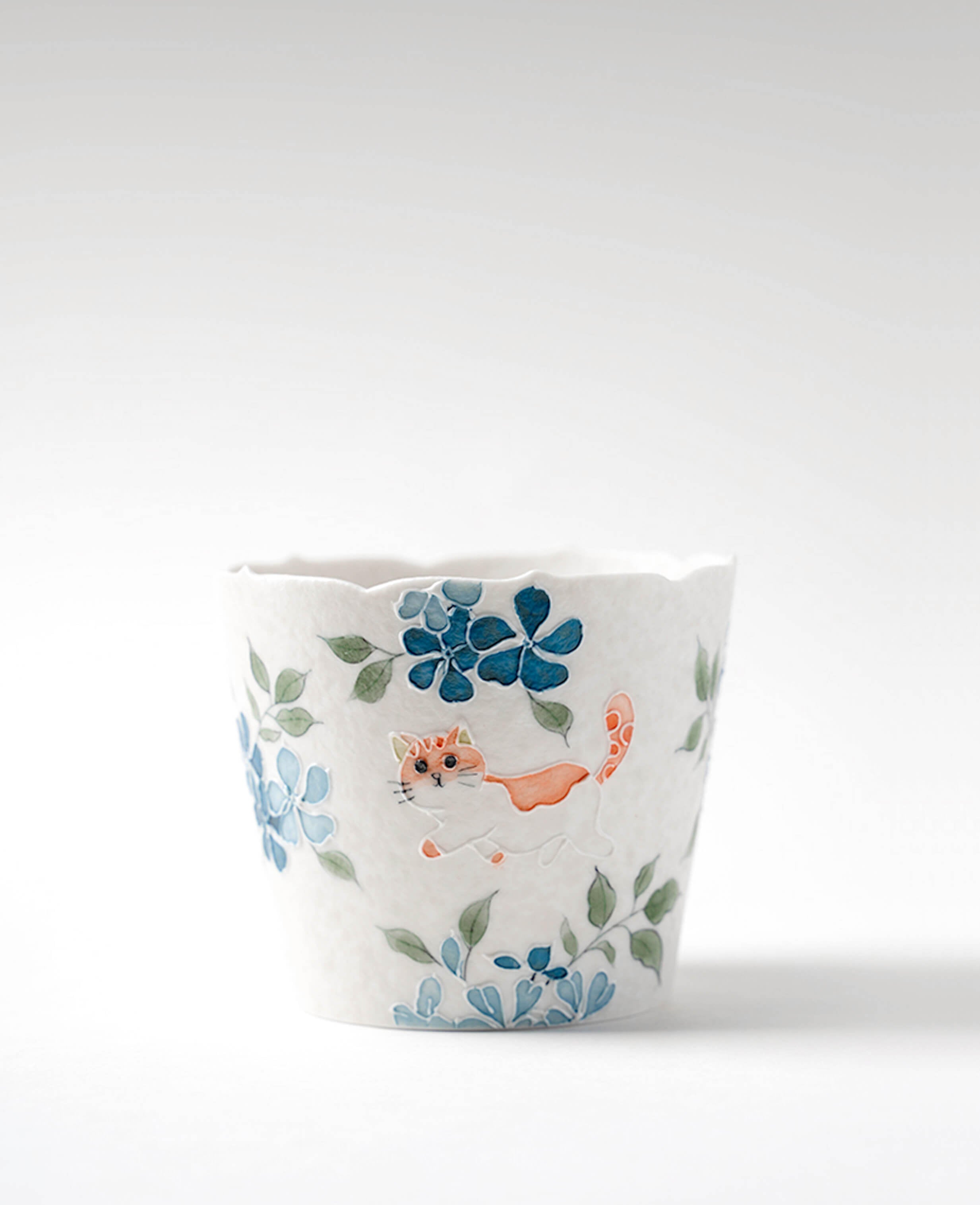whisker trail hand painted porcelain cup for coffee and tea with blue floral and cute cat pattern from kindred friends collection ts & cs