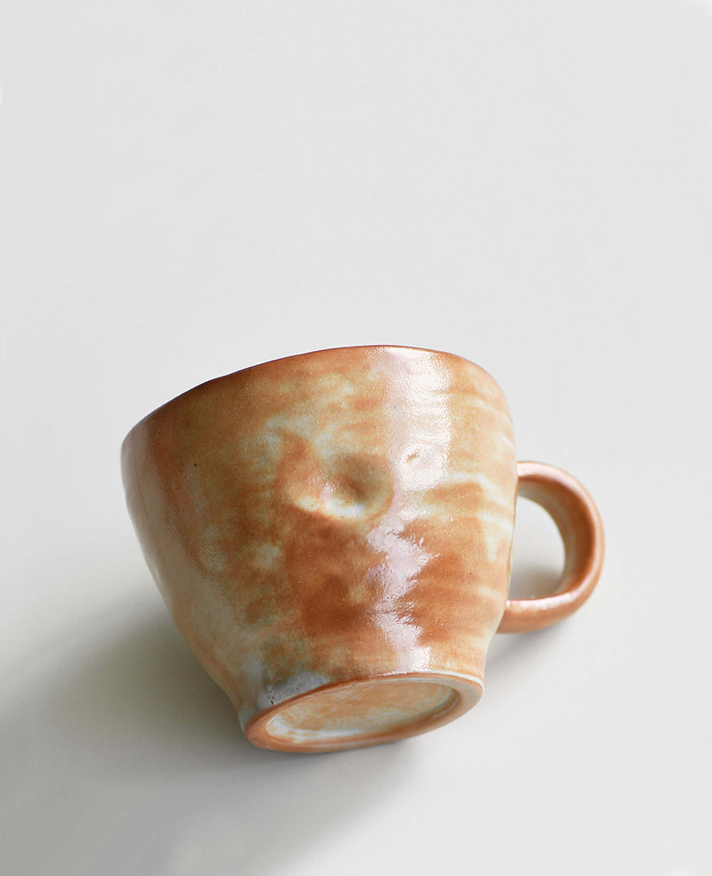 amber veil handcrafted pottery coffee and tea cup with textured warm glaze surface