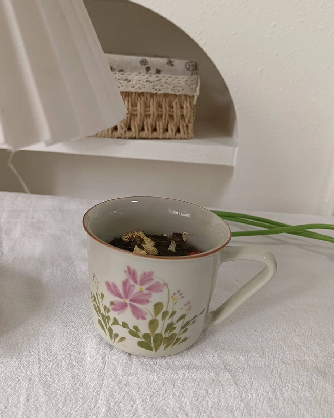 april verse handpainted porcelain coffee and tea cup placed on a softly lit table for tea from customer review