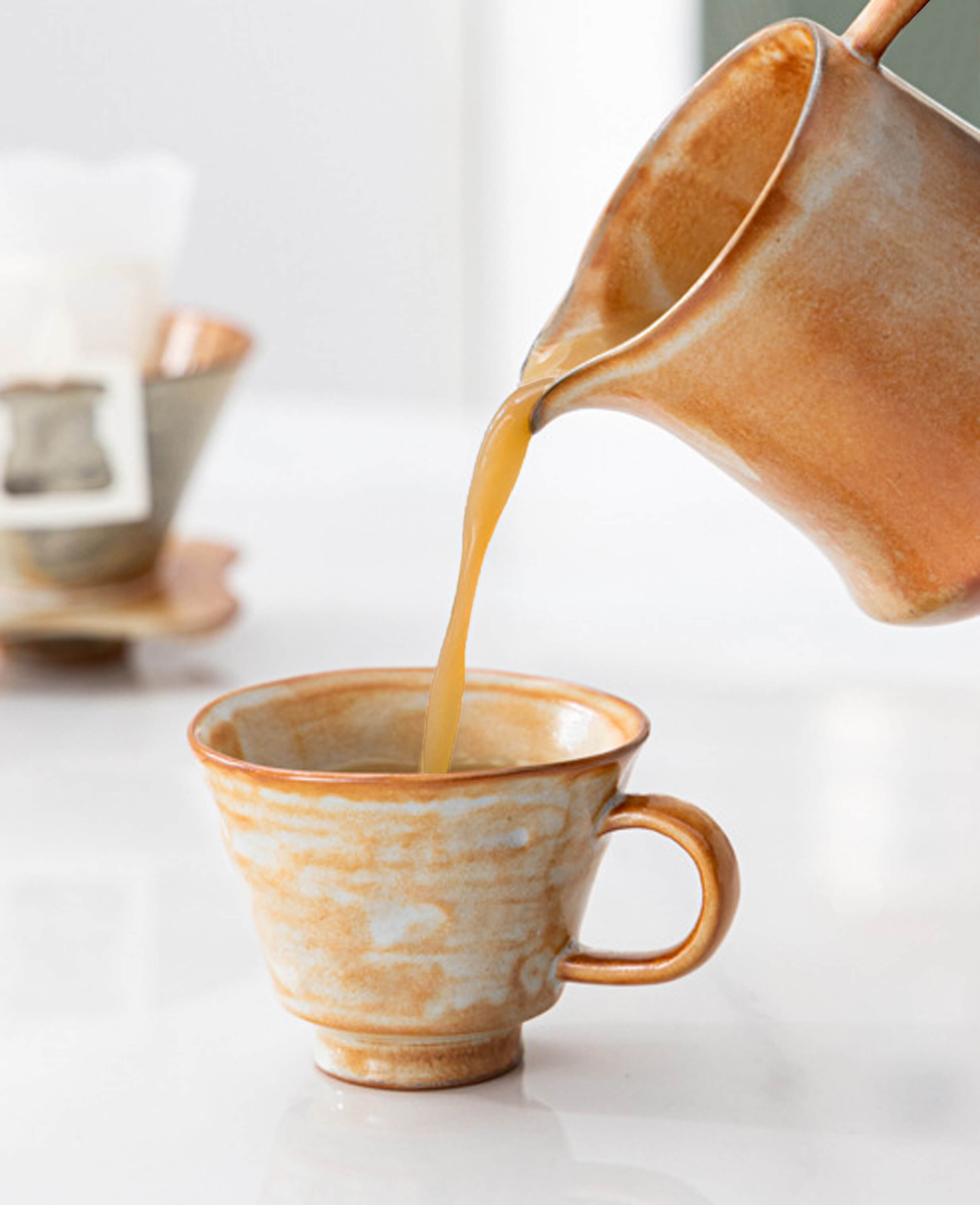 ashenstill handmade ceramic coffee and tea cup with pour over filter brewing scene in stoneware