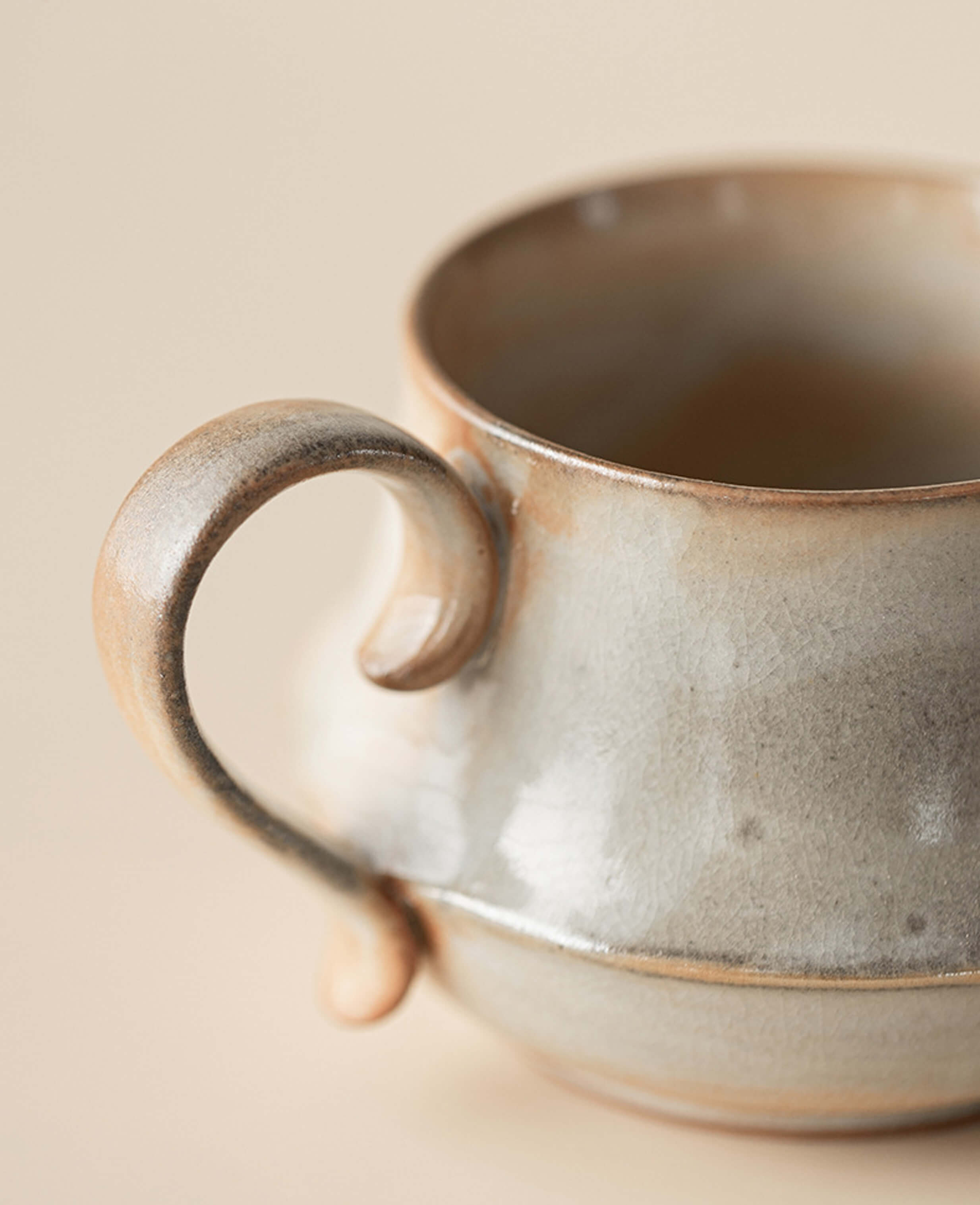 close up of ceramic coffee and tea mug claybourne handle handcrafted with speckled stoneware glaze