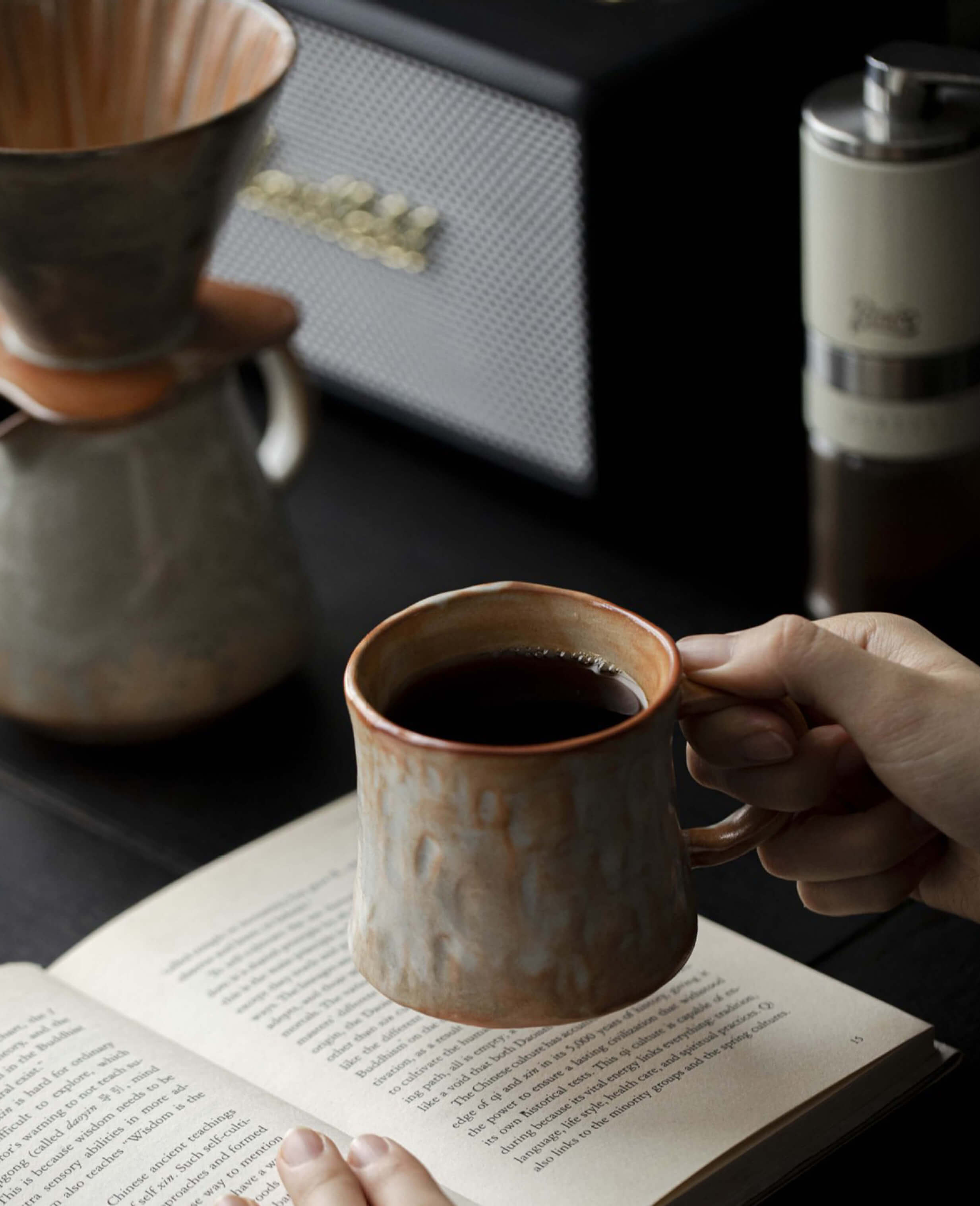 handmade mistburn ceramic coffee and tea mug australian artisan stoneware with wood fired character reading scene