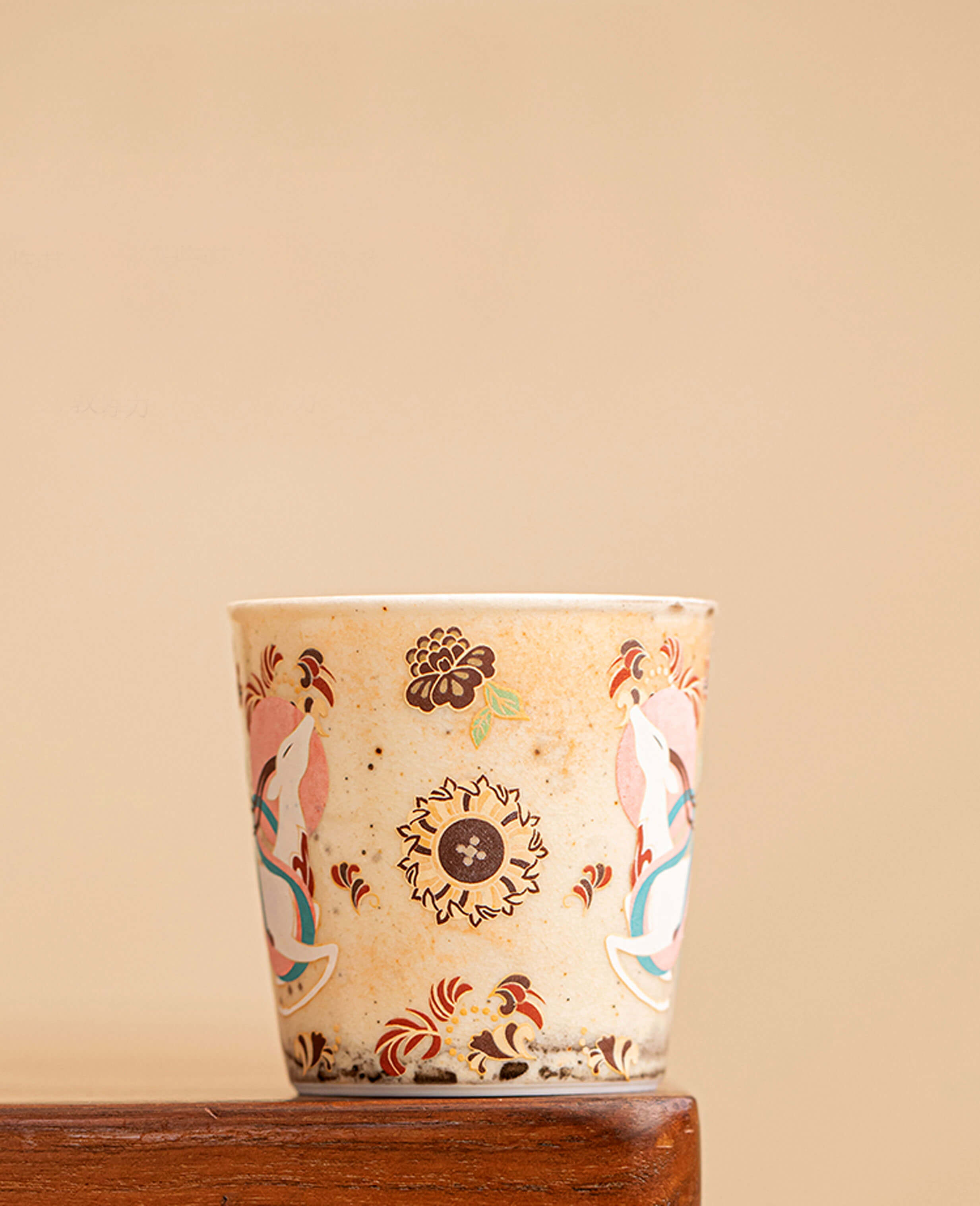 side view of nine coloured deer aroma cup elegant floral motif and mythical deer design on a handmade ceramic coffee and tea cup inspired by dunhuang art