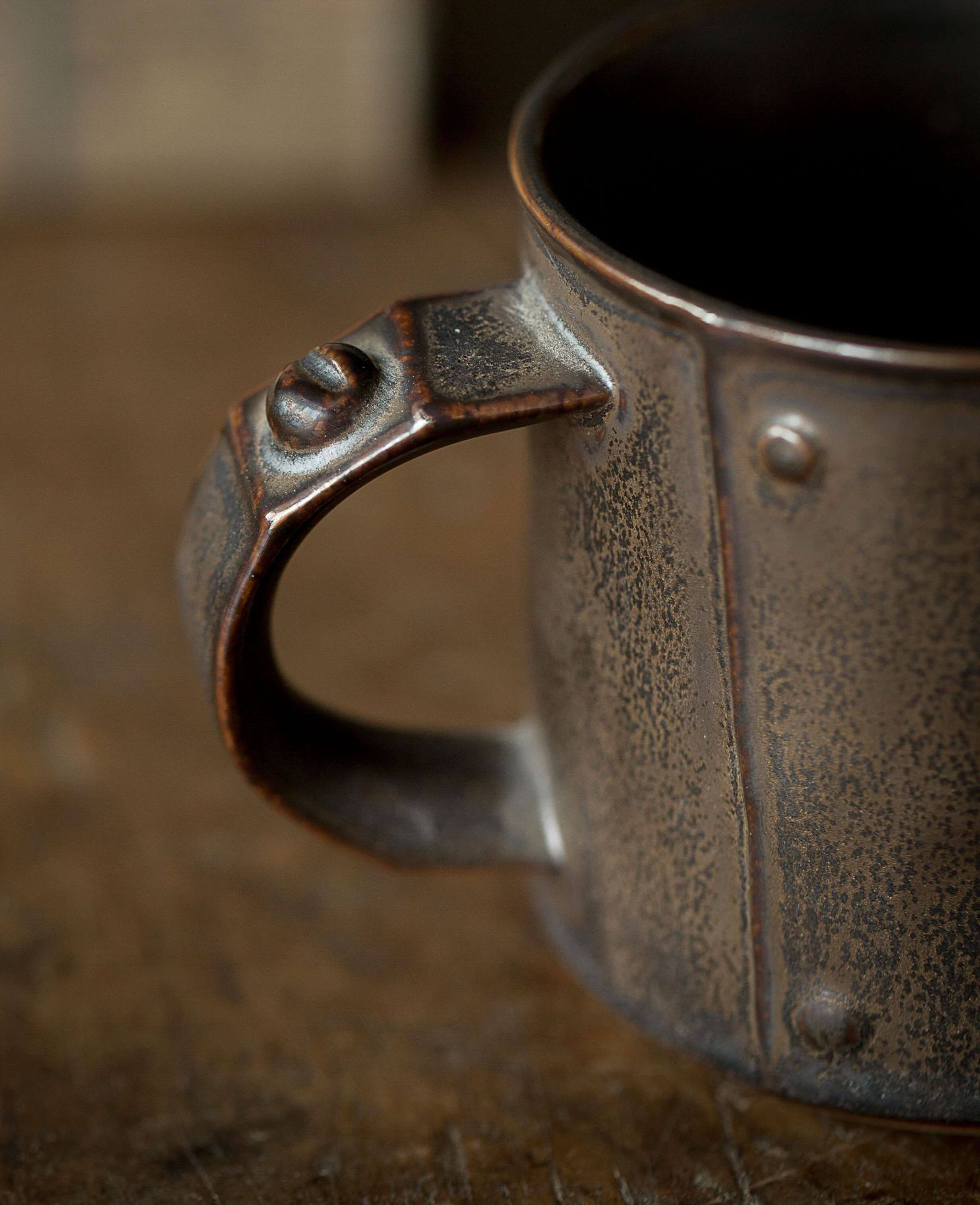 close-up of ironhold mug handle with rivet detailing