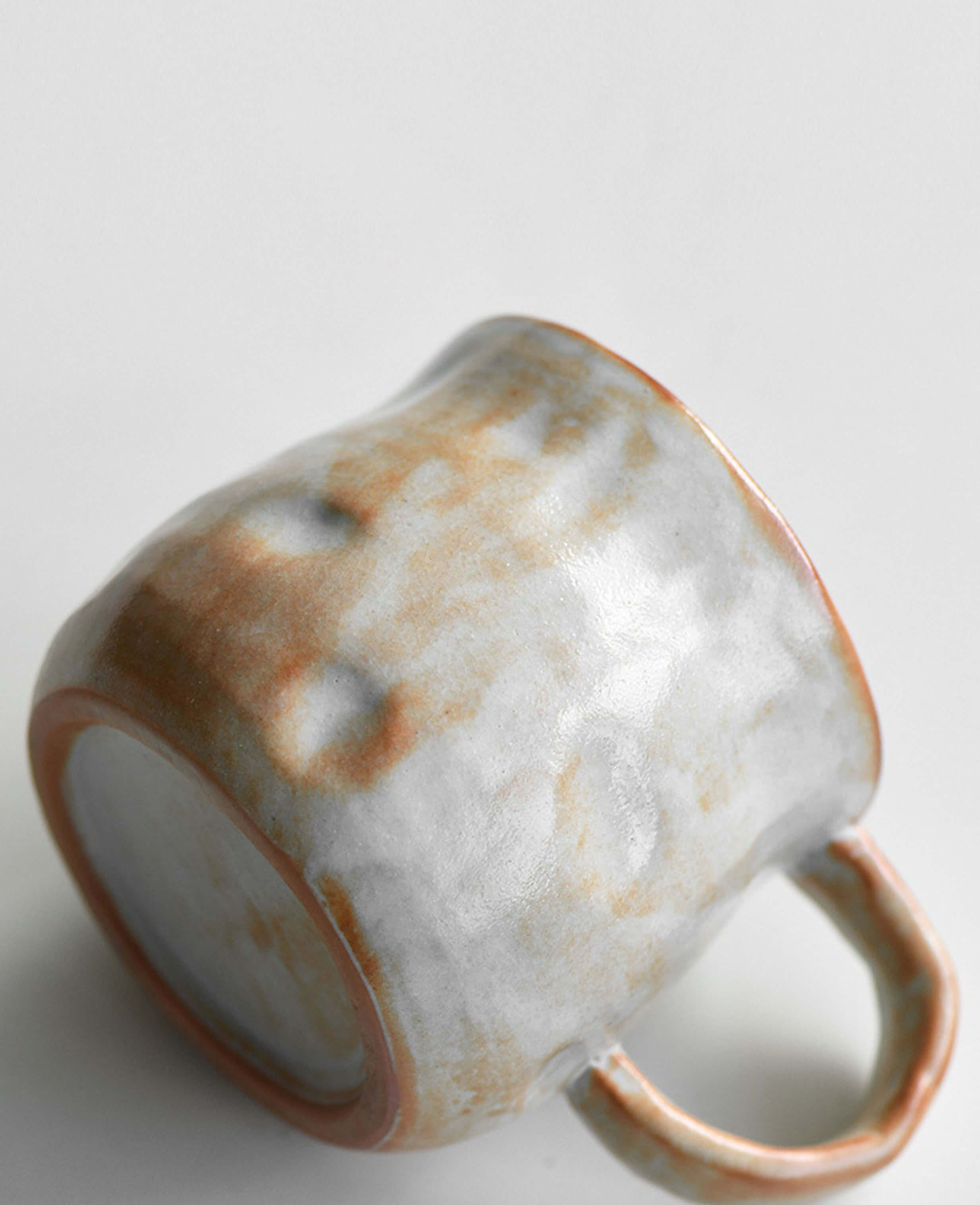 rustic handcrafted stoneware coffee and tea cup side texture snowcrest wood fired flame glaze with organic form