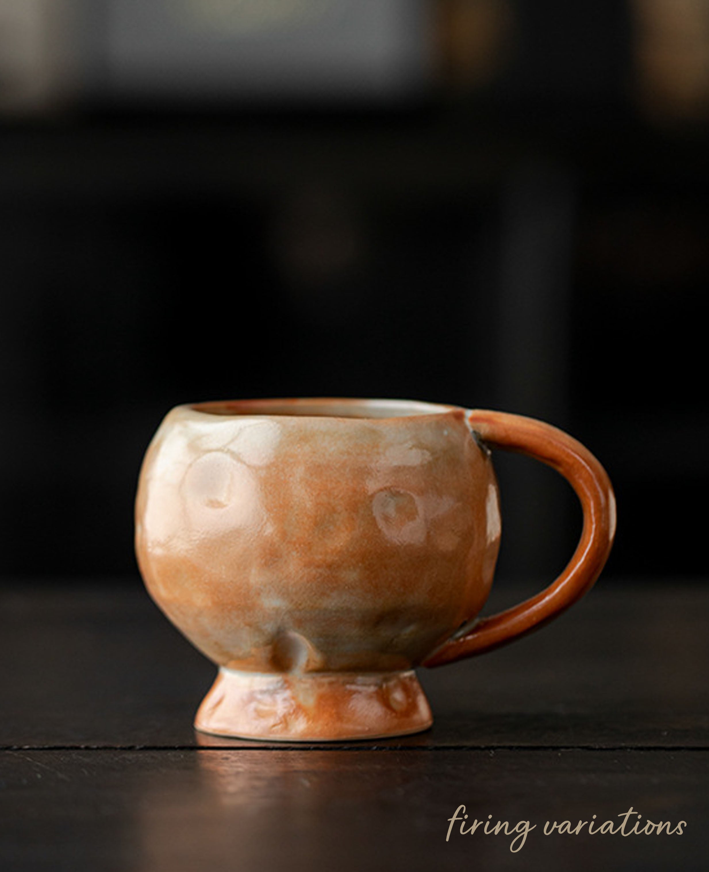 solterra handcrafted ceramic coffee and tea cup with warm terracotta glaze on dark background