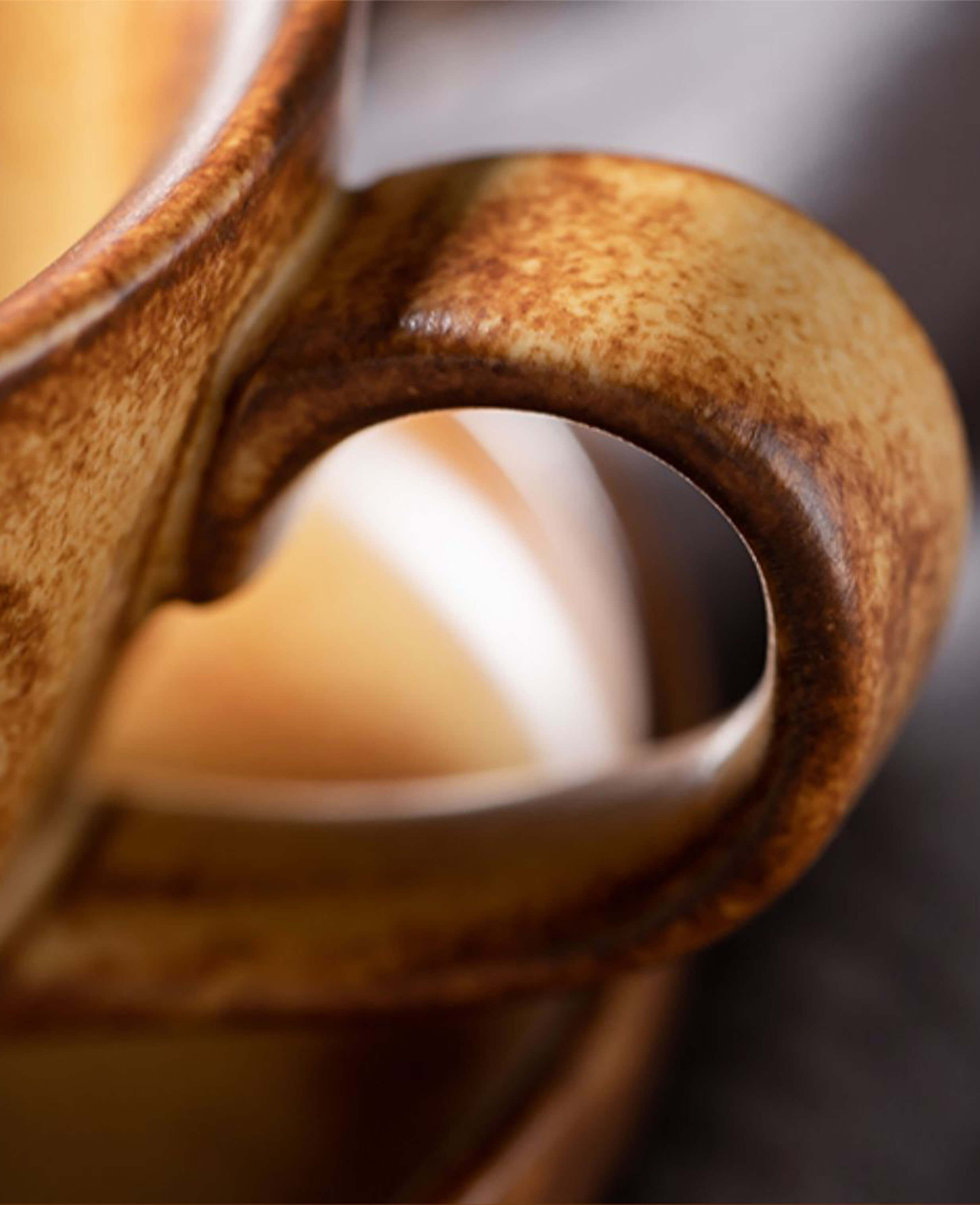 toffee reverie bellara stoneware coffee mug handle closeup with warm toffee glaze