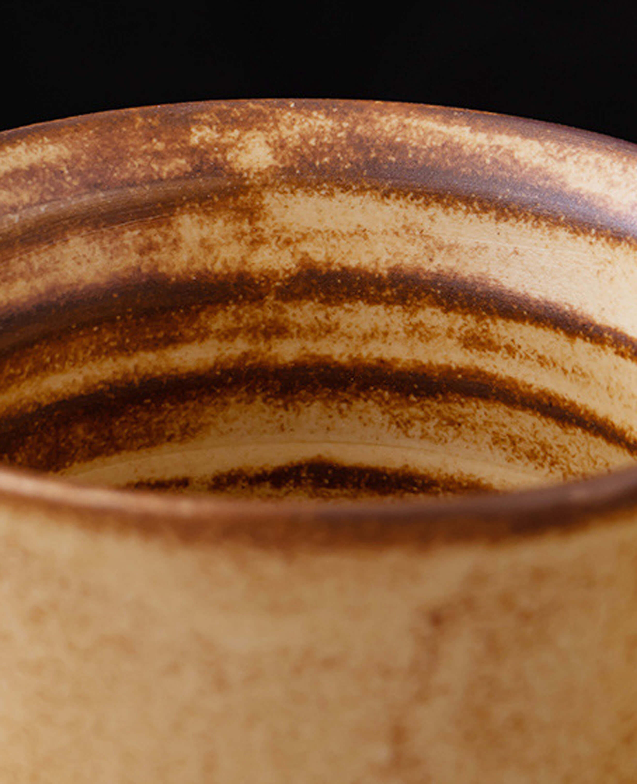 close up of the unique inner glaze texture of toffee reverie thalen ceramic coffee cup